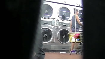 I flash upskirt in front of a young man at the laundry because Im an exhibitionist and love exposing herself to a voyeur Pt 2